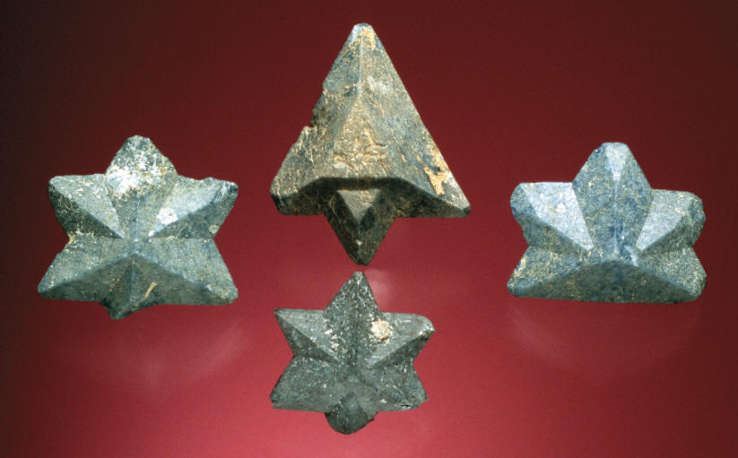 Twinned benitoite crystals up to 3.3 cm. B. Gray specimens. J. Scovil photo.