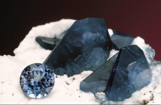 Benitoite crystals with 1.43 ct gemstone. Collector’s Edge specimens. J. Scovil photo.
