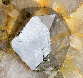 Sperrylite crystal 9 mm high. Wallbridge specimen. M. Bainbridge photo.