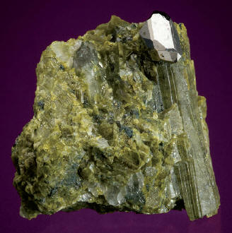 Sperrylite crystal in epidote matrix, crystal 4.5 mm high. Wallbridge specimen. M. Bainbridge photo.