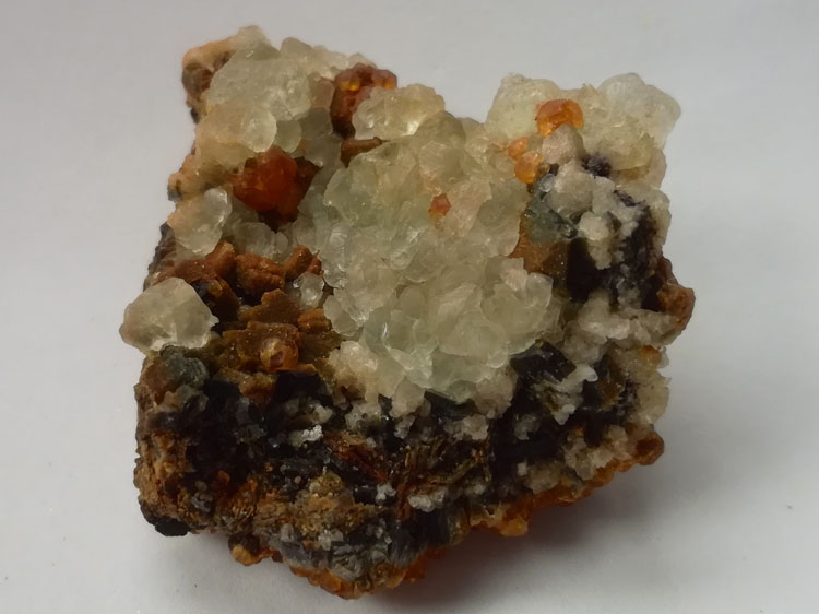 Pale green fluorite and fendarite-manganese-alumina garnet symbiotic specimens protolith,Fluorite,Garnet